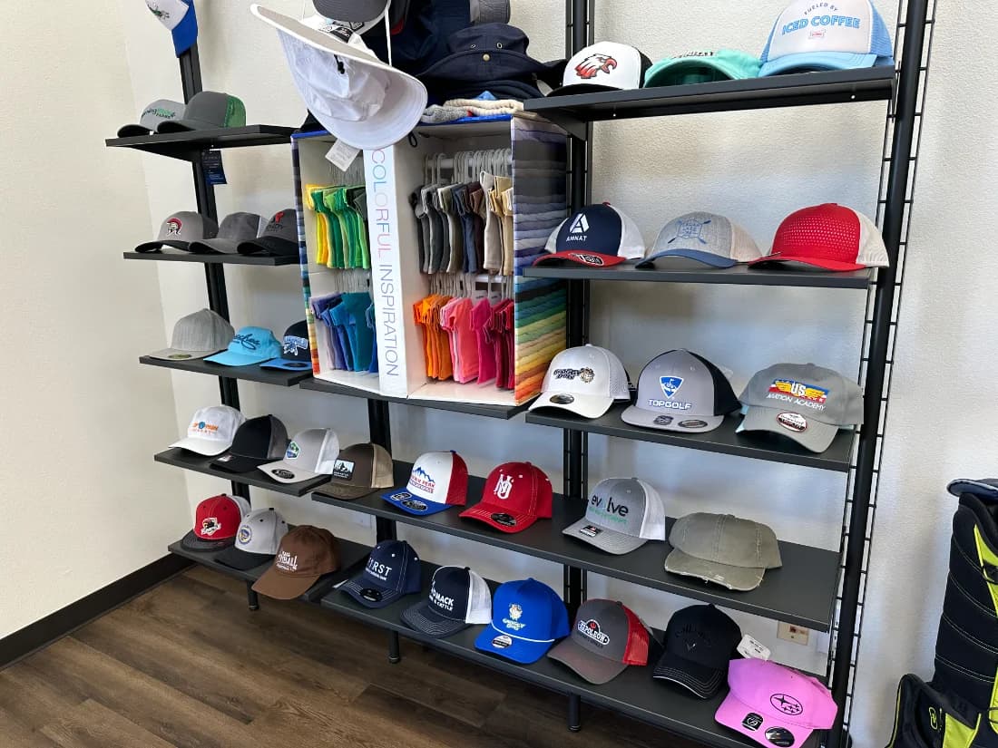Showroom hat wall of embroidered caps