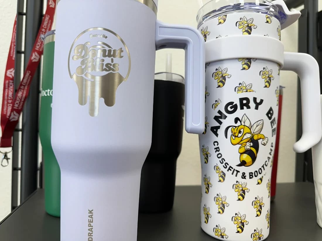 Laser-etched and full-wrap branded tumblers